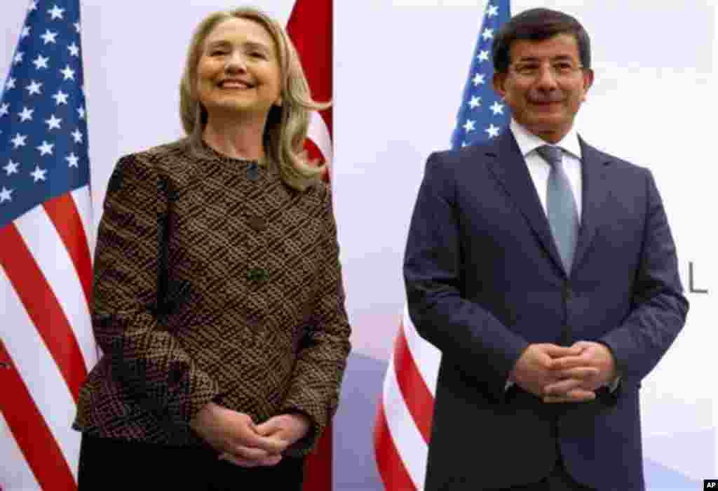 Turkish Foreign Minister Ahmet Davutoglu and US Secretary of State Hillary Rodham Clinton pose before a press conference at the Global Counterterrorism Forum in Istanbul on Thursday June 7, 2012. (AP Photo/Saul Loeb, Pool)