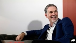 Founder and CEO of Netflix Reed Hastings smiles during an interview with The Associated Press in Barcelona, Spain, Feb. 28, 2017.