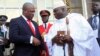 Ghana's President John Dramani Mahama (L) speaks with Gambia's President Yahya Jammeh (R) after a West African regional bloc ECOWAS summit on the crisis in Mali and Guinea Bissau, in Yamoussoukro, Ivory Coast, Feb. 27, 2013.