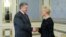 FILE - Ukrainian President Petro Poroshenko greets Cindy McCain at the Presidential Palace in Kyiv, Ukraine, April 1, 2019. 