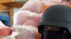 A policeman stands guard near bags of methamphetamine pills during the 39th Destruction of Confiscated Narcotics in Ayutthaya province, nearly 80 km (50 miles) north of Bangkok, June 24, 2011. About 5,844 kg (12,884 lbs) of drugs, among them methamphetami