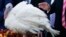 In this Nov. 21, 2017, photo, President Donald Trump pardons Drumstick during the National Thanksgiving Turkey Pardoning Ceremony in the Rose Garden of the White House in Washington. A poll shows more than a third of Americans dread the prospect of political talk over Thanksgiving. 