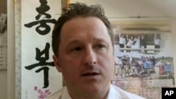 FILE - In this file image made from a March 2, 2017, video, Michael Spavor, director of Paektu Cultural Exchange, talks during a Skype interview in Yanji, China. 