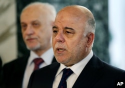 FILE - To head off a repeat of last weekend’s protests, Iraqi Prime Minister Haider al-Abadi, pictured at a news conference in Baghdad in April 2015, needs to start implementing reforms, something he's been unable to do for months.