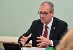 FILE - Hans Kluge, World Health Organization regional director for Europe, attends a meeting with Russian Prime Minister Mikhail Mishustin in Moscow.