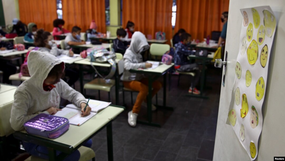 FILE - Students study as in-person learning resumes in Sao Paulo, Brazil, Oct. 18, 2021.