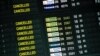 FILE - The pandemic has been tough on the travel industry. This May 12, 2020, photo of a departure timetable board displays canceled flights at Brussels Airport in Brussels, with disruptions due mainly to COVID-19.