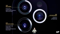 Phil Schiller talks about the new iPhone 11 Pro and Max, during an event to announce new products Tuesday, Sept. 10, 2019, in Cupertino, Calif. (AP Photo/Tony Avelar)