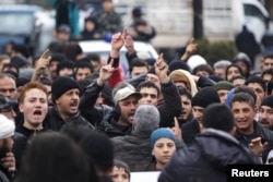 People shout slogans during a protest after Friday prayers, calling for the lifting of the siege off Madaya, in the rebel-controlled area of Maaret al-Numan town in Idlib province, Syria, Jan. 8, 2016.