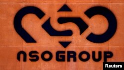 FILE The logo of Israeli cyber firm NSO Group is seen at one of its branches in the Arava Desert, Israel, July 22, 2021. 