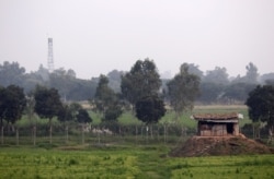 FILE - An Indian Border Security Force (BSF) bunker is seen near the fenced border with Pakistan in Suchetgarh, southwest of Jammu, Sept. 30, 2016.