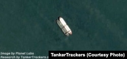 In this satellite photo sent to VOA Persian, oil shipment monitoring company TankerTrackers.com says 2 million barrels of crude oil were being transferred from an Iranian tanker to a client’s vessel in an undisclosed area in February 2019.