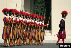 FILE - Swiss Guards stand at attention prior to Lebanon's President Michel Aoun arrival to meet with Pope Francis at the Vatican March 16, 2017.