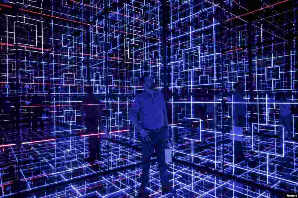 A man looks at an exhibition called &quot;Oh! Future Sensation&quot; as part of Saint-Gobain&#39;s 350th anniversary celebrations, in Sao Paulo, Brazil.