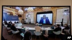 Democratic Republic of the Congo's President Felix Tshisekedi speaks during a video conference at the One Planet Summit, at the Elysee Palace, in Paris, Jan. 11, 2021.