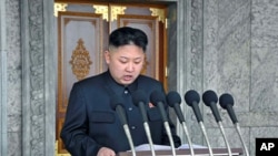 North Korean leader Kim Jong Un delivers a speech during a mass military parade in Kim Il Sung Square, April 15, 2012. 