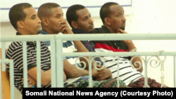 Defendants Abdiweli Ahmed Diriye, Abdul Abdi Warsame, Hassan Aden Isak, and Mukhtar Mohamud Hassan appear before a military tribunal in Mogadishu, Jan. 1, 2018, in connection with the Oct. 14 truck bombing in Mogadishu that killed 512 people.