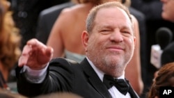 FILE- In this Feb. 22, 2015 file photo, Harvey Weinstein arrives at the Oscars at the Dolby Theatre in Los Angeles. 