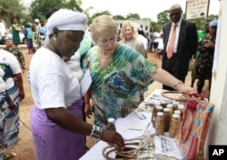 Michelle Bachelet, Executive Director of UN Women, views local products made and sold in Totota, Liberia (March 7, 2011). She was visiting the country to commemorate the 100th anniversary of International Women's Day.