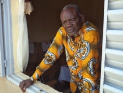 FILE - Clement Abaifouta, the head of an association of victims of former Chadian dictator Hissene Habre, poses for a picture at his home in Ndjamena, Chad, July 11, 2015.