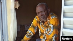 FILE - Clement Abaifouta, the head of an association of victims of former Chadian dictator Hissene Habre, poses for a picture at his home in Ndjamena, Chad, July 11, 2015.