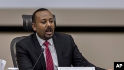 FILE: Ethiopia's Prime Minister Abiy Ahmed at the prime minister's office in the capital Addis Ababa, Ethiopia Mon. Nov. 30, 2020. His government is now demobilizing state militias, integrating forces into the national military. 