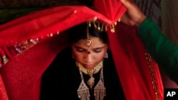 Zareena, a Kashmiri Bakarwal bride is seen inside her tent during her wedding ceremony on the outskirts of Srinagar, India, May 31, 2013.