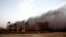 Smoke rises during clashes between Egyptian security forces and suspected militants, not pictured, in the town of Kirdasah, near Giza Pyramids, Egypt, Sept. 19, 2013.