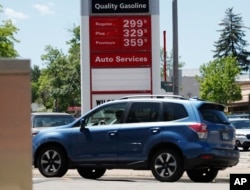 Prices for the three grades of gasoline light up the pump at a Conoco station, May 25, 018, in east Denver. Memorial Day vacationers are facing the highest prices at the pumps since 2014 as the average cost of a gallon of regular unleaded is just less than $3.