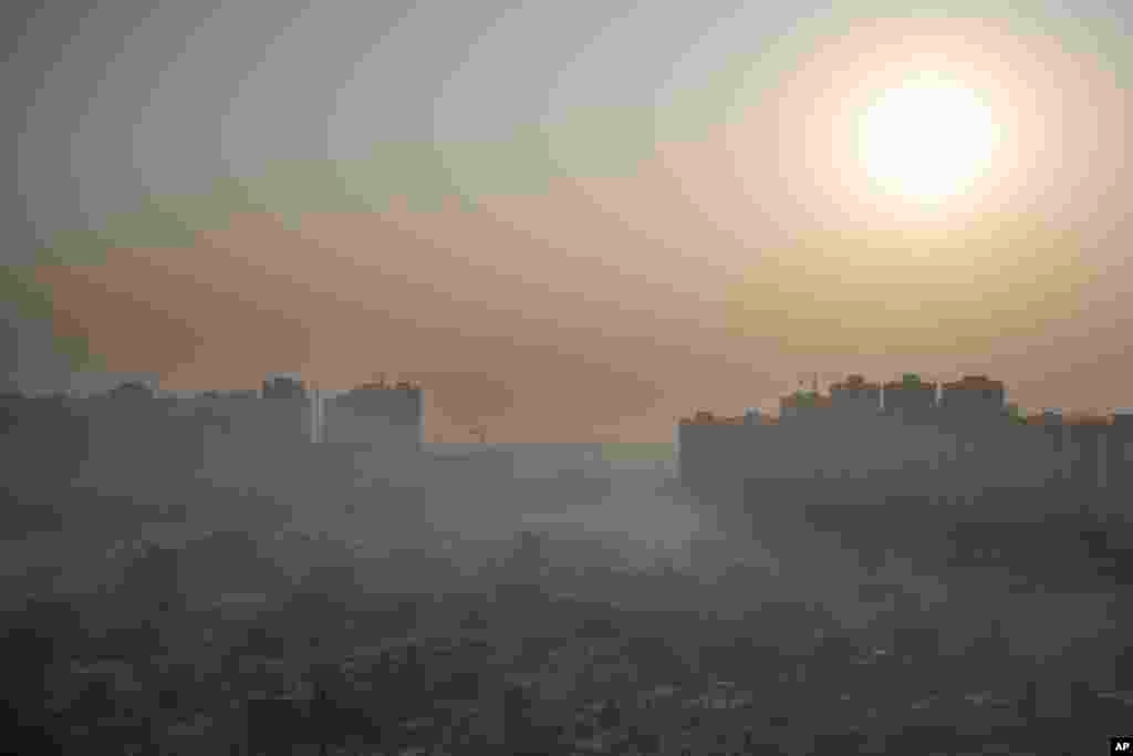 Morning haze envelops the skyline on the outskirts of New Delhi, India, Friday, Oct. 16, 2020. The national capital, one of the world’s most polluted cities, enjoyed a respite from air pollution up until September due to a strict virus lockdown. But now w