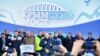 Amid Western Condemnation, Putin Opens Crimea Bridge to Rail Traffic