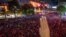 A pro-democracy protester flashes a three-finger salute, a symbol of resistance, during an anti-government rally in the central business district of Bangkok, Thailand, Oct. 15, 2020. 