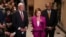 House Speaker Nancy Pelosi, center, with Majority Leader Steny Hoyer, left, and Majority Whip James Clyburn updates reporters after delays in the vote to advance President Joe Biden's domestic policy package, at the Capitol in Washington, Nov. 5, 2021.