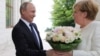 Pipelines, Roses and Nukes: Putin, Merkel Meet Amid Strained US Ties