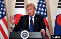 U.S. President Donald Trump gestures as he speaks during a joint press conference with South Korea's President Moon Jae-in (not pictured) at the presidential Blue House in Seoul, South Korea, Nov. 7, 2017.