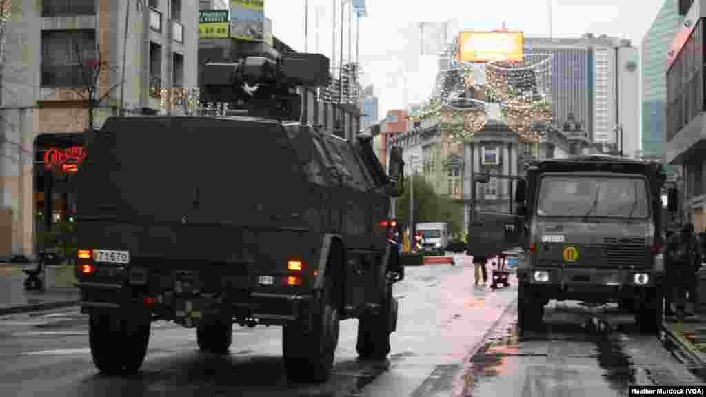 The military presence in Brussels appeared lighter on Tuesday as schools prepared to reopen on Wednesday, Nov. 24, 2015.