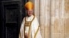 FILE - Archbishop of Canterbury Justin Welby stands at Westminster Abbey ahead of the coronation of King Charles III and Camilla, the Queen Consort, in London, May 6, 2023.