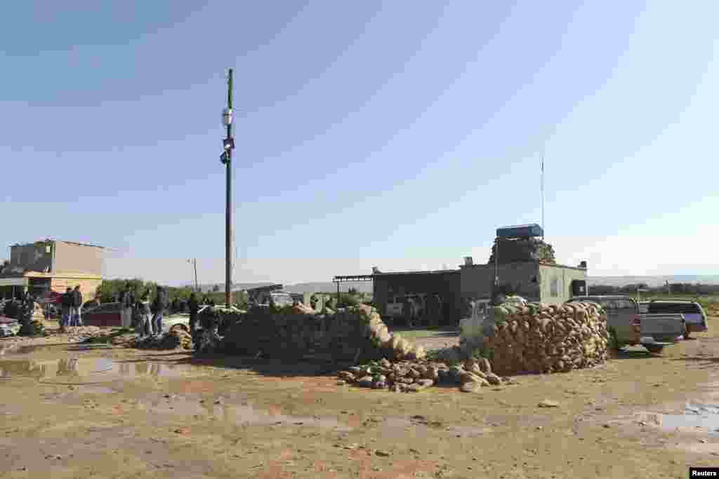 The scene at a military base 50 km outside Benghazi, after a suicide bomber detonated a truck packed with explosives at an army checkpoint, Barsis, Libya, Dec. 22, 2013.&nbsp;