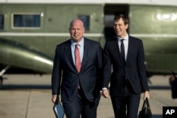 Acting United States Attorney General Matt Whitaker, left, and President Donald Trump's White House Senior Adviser Jared Kushner, right, board Air Force One at Andrews Air Force Base, Md., Dec. 7, 2018.