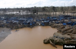 FILE - A view of an illegal gold mining camp in a zone known as Mega 14, in the southern Amazon region of Madre de Dios, July 14, 2015.