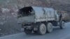 FILE - Armenian soldiers drive on a truck while leaving Karvatchar town in Nagorno-Karabakh, Nov. 24, 2020. Tensions have again risen between Armenia and Azerbaijan over the contested region.