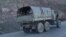 FILE - Armenian soldiers drive on a truck while leaving Karvatchar town in Nagorno-Karabakh, Nov. 24, 2020. Tensions have again risen between Armenia and Azerbaijan over the contested region.
