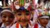 Boys dressed in white depicting holy cows participate in a parade to mark Gaijatra Festival, also known as the festival of cows, in Kathmandu, Nepal.