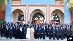 Foreigns Ministers pose for photographers during a meeting of the Friends of the Syrian People in Marrakech, Morocco, Wednesday Dec. 12, 2012. More than 100 countries on Wednesday recognized a new Syrian opposition coalition.