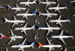 FILE - Grounded Boeing 737 MAX aircraft are seen parked at Boeing Field in Seattle, Washington.