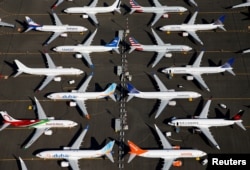 FILE - Grounded Boeing 737 MAX aircraft are seen parked at Boeing Field in Seattle, Washington.