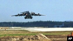 FILE - A US Air Force C17 Globemaster 3 transport plane takes off from Ramstein airbase, with humanitarian aid.