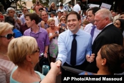 In this March 11, 2016, photo, Republican presidential candidate, Sen. Marco Rubio, R-Fla. greets supporters in Naples, Fla.