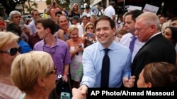 FILE - In this March 11, 2016, photo, then-Republican presidential candidate Sen. Marco Rubio, R-Fla., greets supporters in Naples, Florida. 