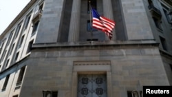 FILE - The U.S. Department of Justice headquarters building is seen in Washington, July 13, 2018.